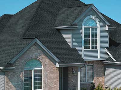Typical mid-class home with black GAF shingles on its roof